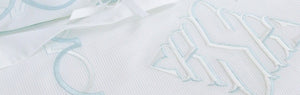 Custom embroidered pique bed coverlets, monogrammed duvet covers, bed shams.